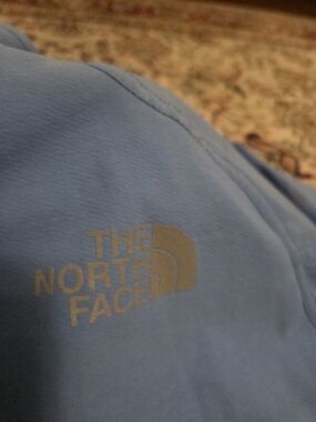 The North Face Light Blue Jacket with Reflective Logo